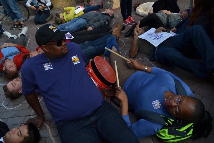 Protesters participating in a die-in in front of the American Petroleum Institute 
