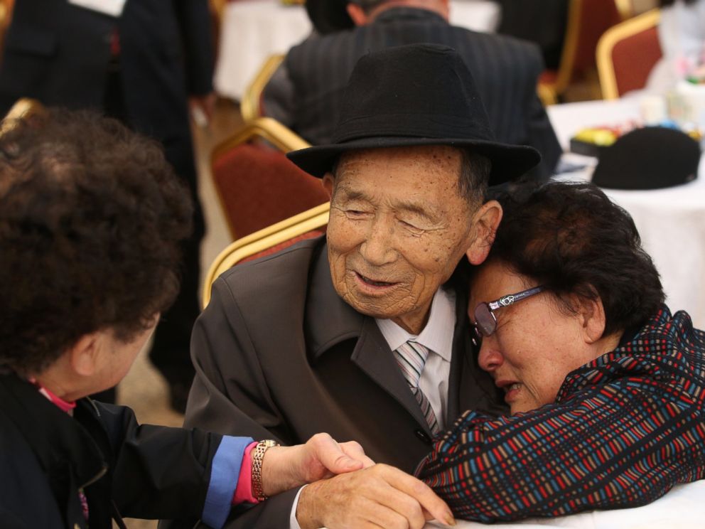 PHOTO: North Korean resident Kim Han-Sik, 86, center, meets his South Korean sister Kim Chul-Sik, 81, right, during a dinner on the first day of the reunions of separated families at Mount Kumgang resort, Kangwon Province, North Korea, Oct. 20, 2015. 
