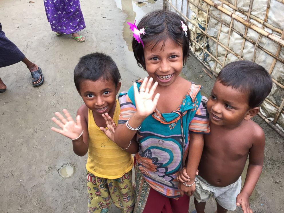 PHOTO: Young Rohingya children wave to the camera at a refugee camp outside of Sittwe, Myanmar.