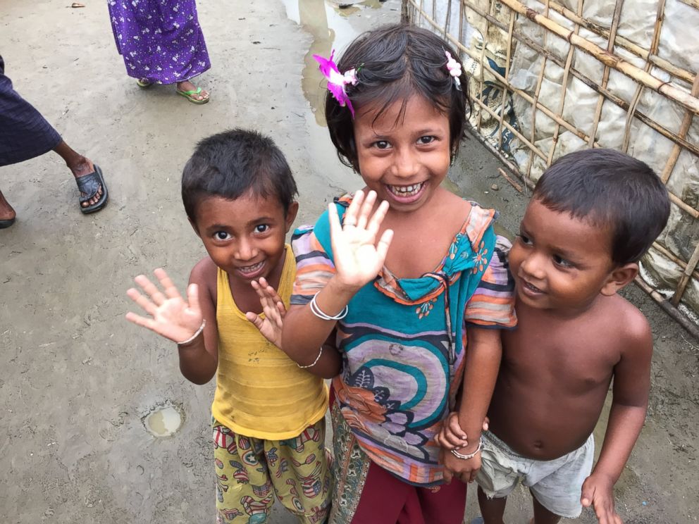 PHOTO: Young Rohingya children wave to the camera at a refugee camp outside of Sittwe, Myanmar.