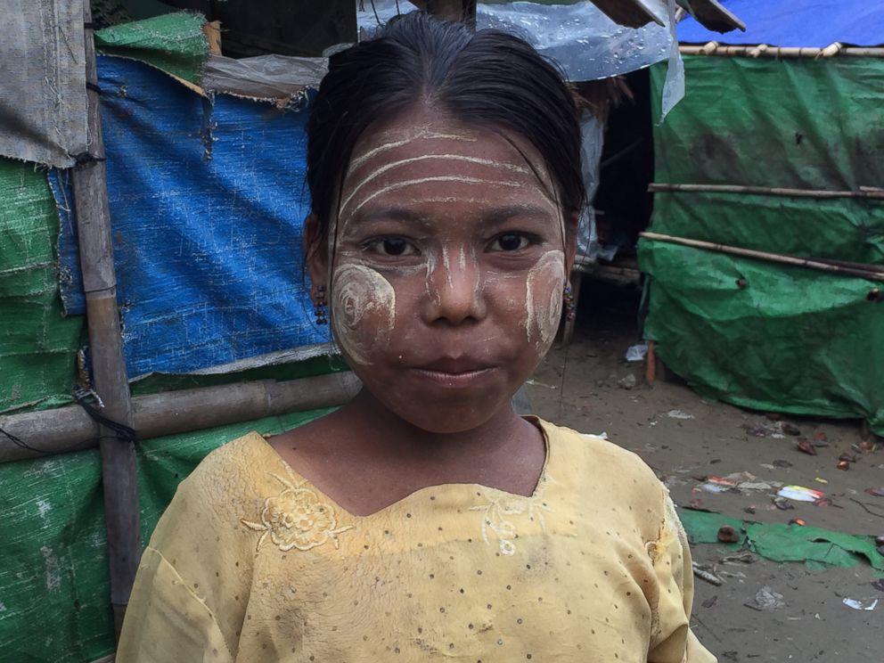 PHOTO: A young Rohingya girl living in a refugee camp outside of Sittwe, Myanmar, wears Thanakha on her face to protect her skin.